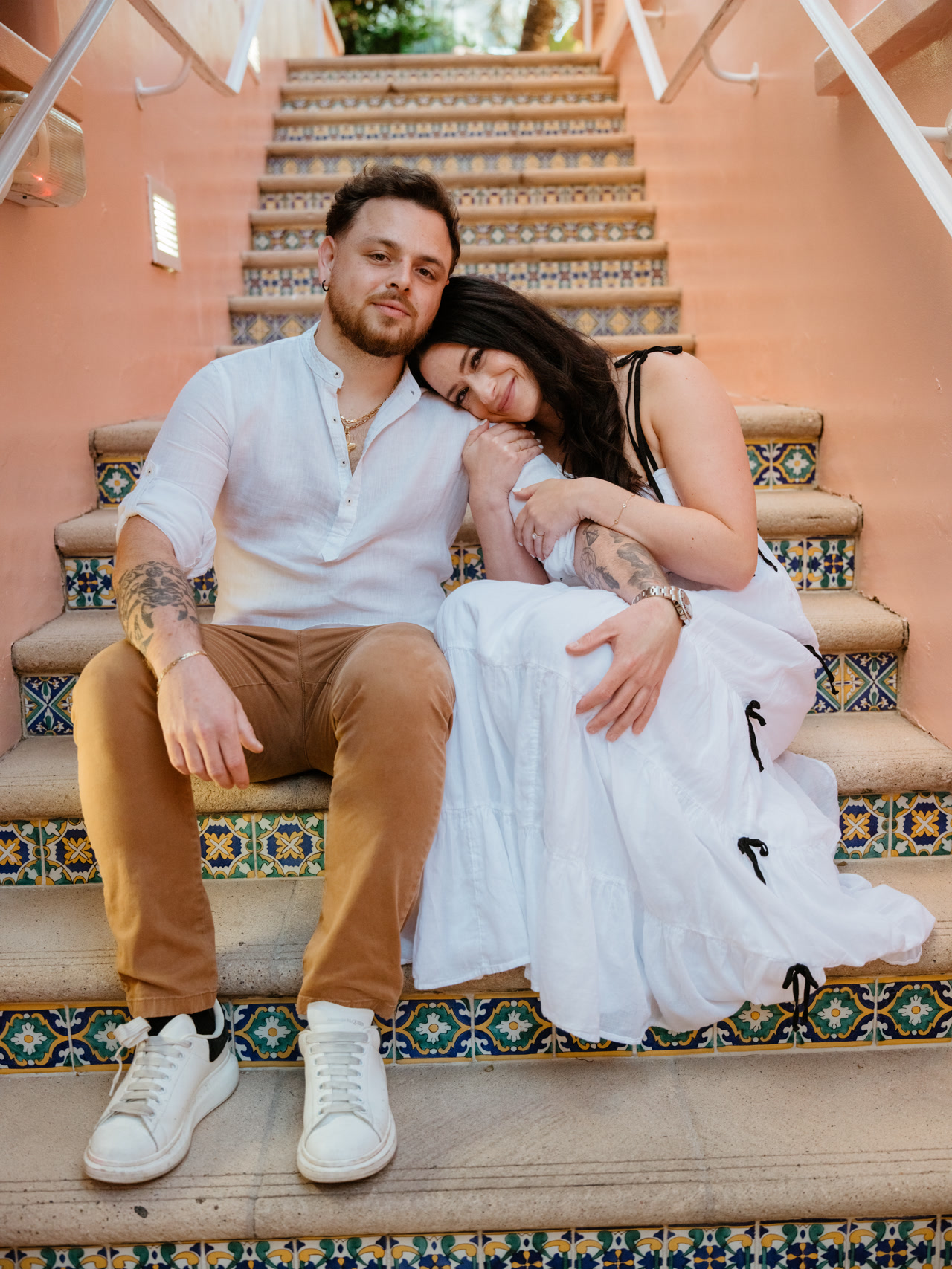 Together on the mosaic tile steps